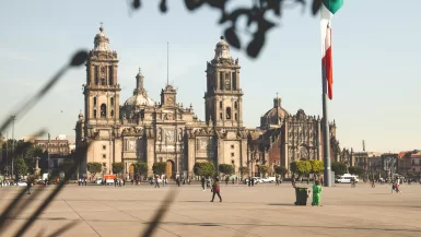 Pros and Cons of Living in Mexico City + Practical Insider Tips 37 people walking on sidewalk near brown concrete building during daytime - pros and cons of living in Mexico City