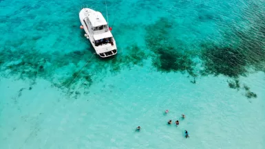 El Cielo Cozumel: Ultimate Guide to Discover Paradise on Earth 25 El Cielo Cozumel coast with boat