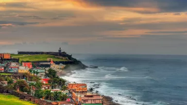 50 Puerto Rico Fun Facts You Need To Know | Local Approved 6 houses near sea under cloudy sky during daytime fun facts Puerto Rico