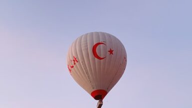 10 Bucket List Experiences Every Adventurer Should Try 5 a hot air balloon flying over a rocky landscape Bucket List