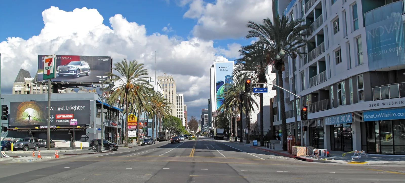 Wilshire Boulevard in Koreatown looking east, with palm trees and apartment towers